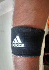 Adidas reversible wristband in action